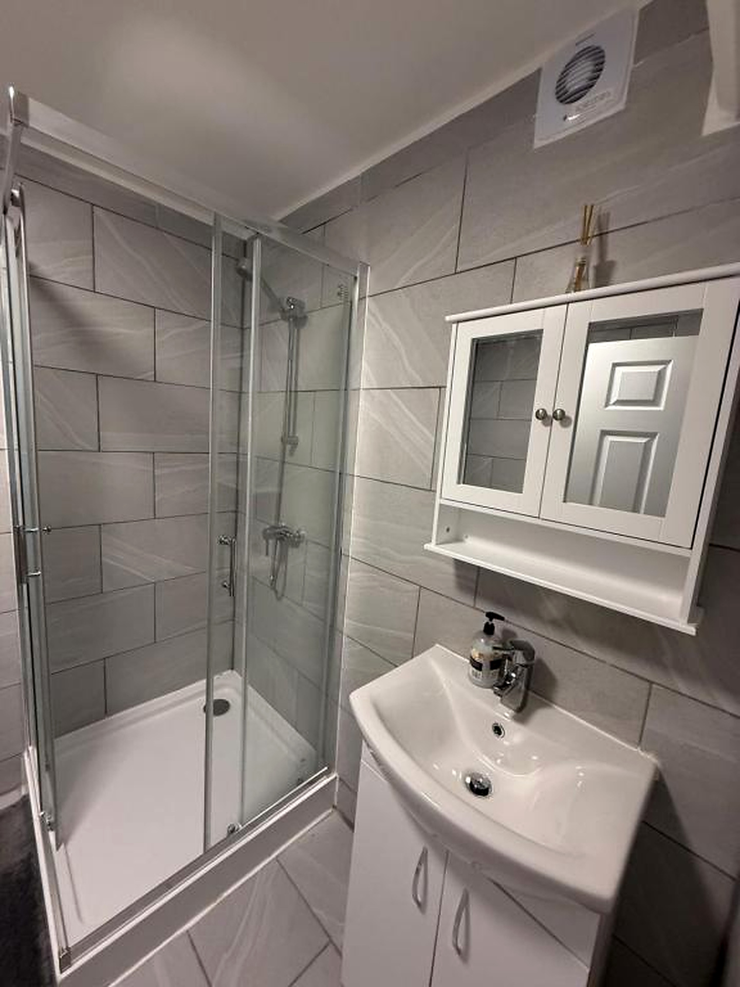 Bathroom with shower and sink