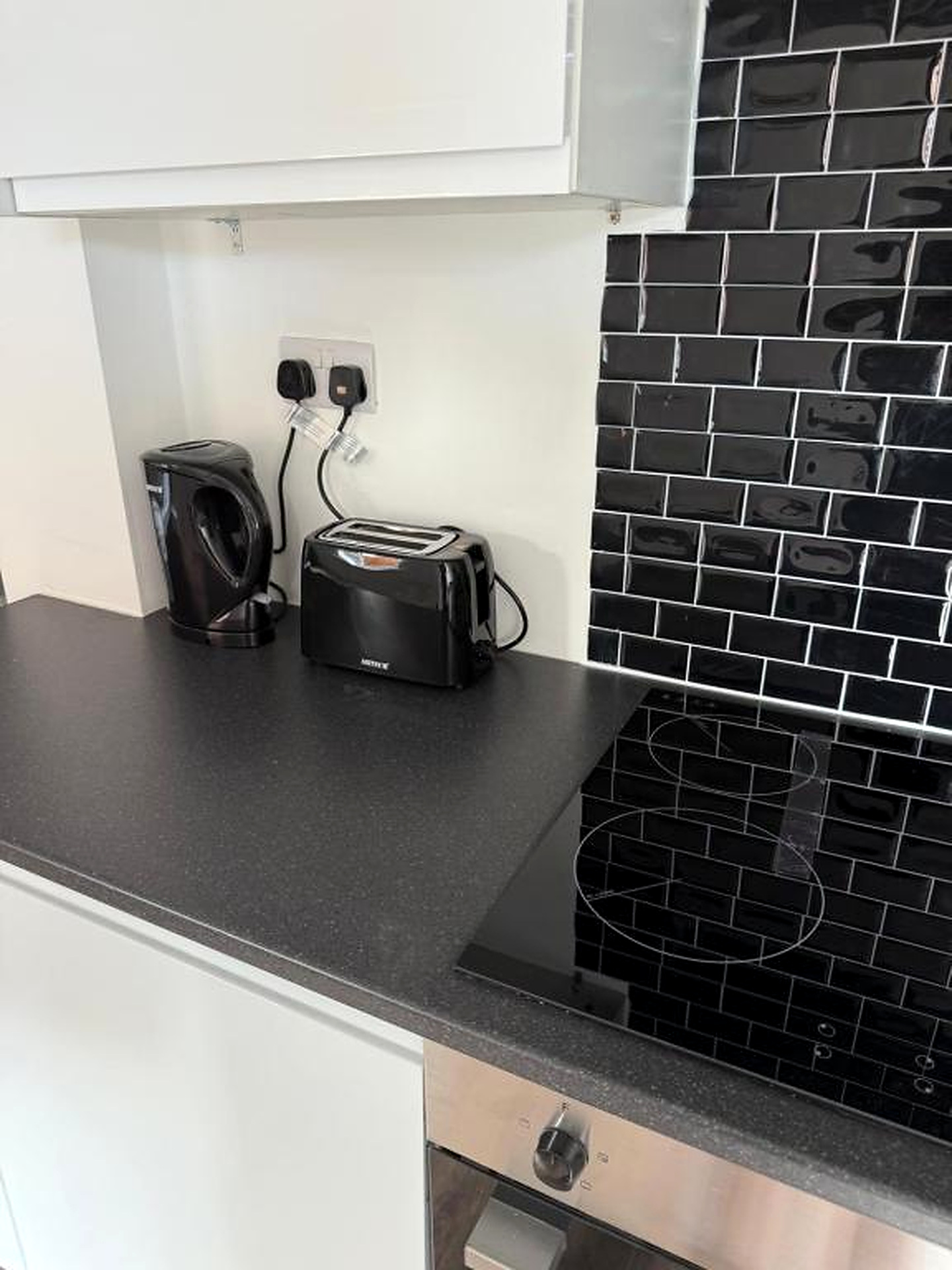 Kitchen counter with kettle, toaster and hob