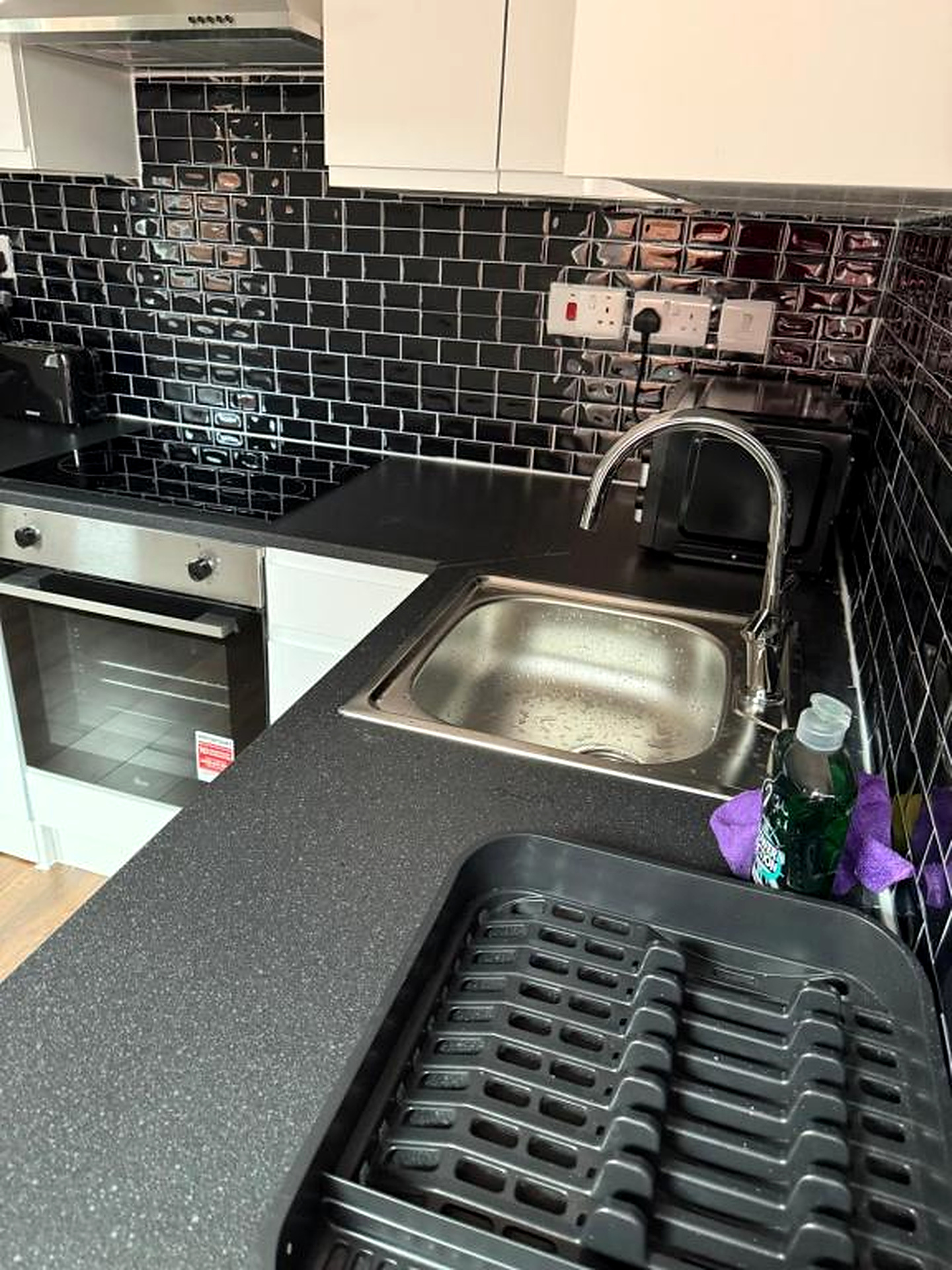 Kitchen counter with sink and strainer