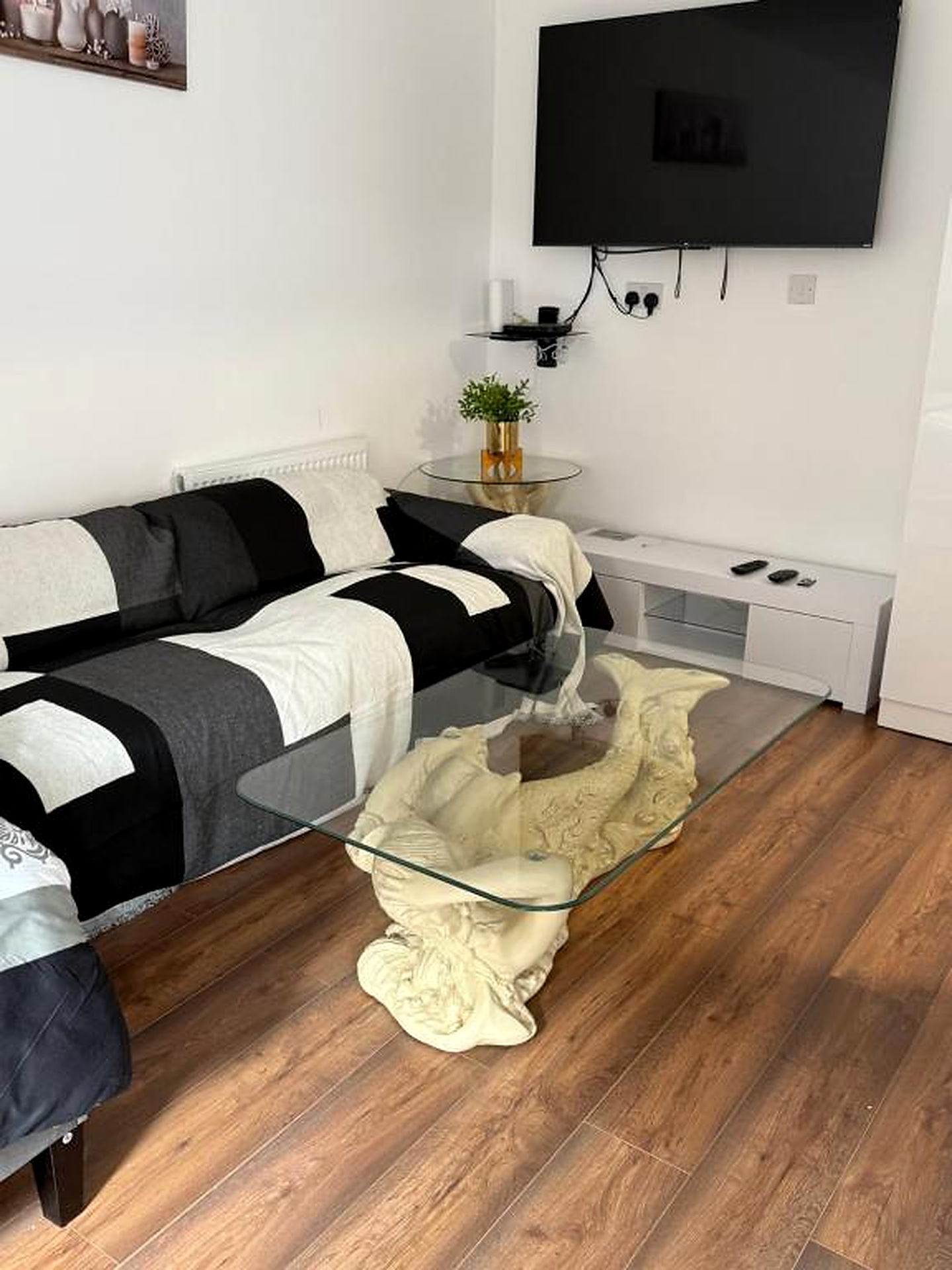 Living room with a sofa and glass coffee table